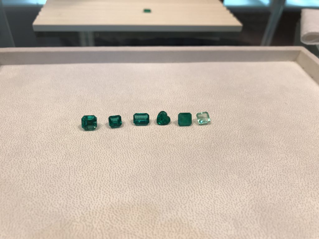 Different qualities of polished emeralds